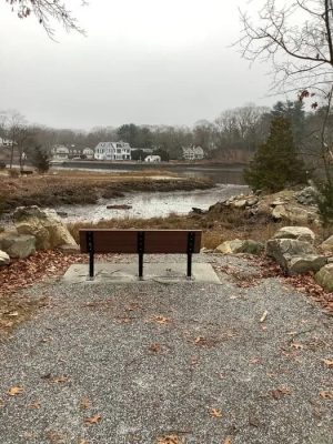 Bench overlooking the river on a Westport town trail